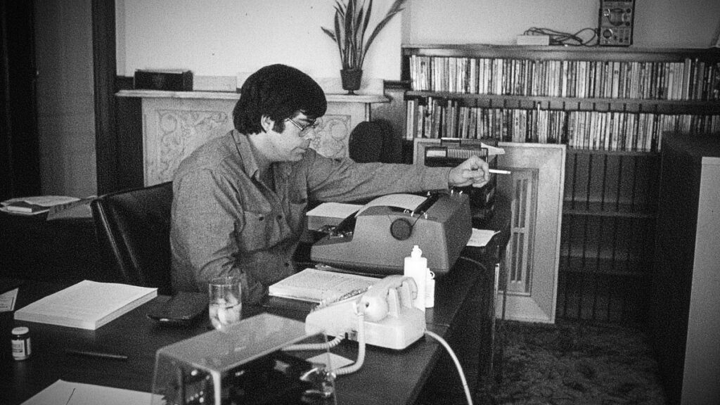 Stephen King working on a typewriter
